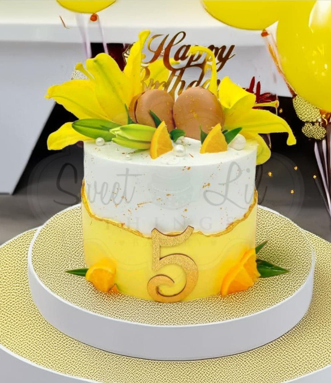 Yellow and White Floral Birthday Cake with Macaroons