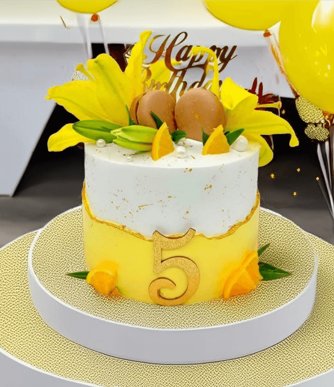 Yellow and White Floral Birthday Cake with Macaroons